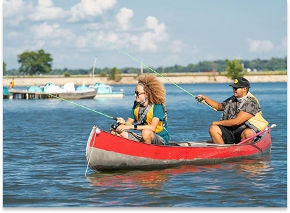 a couple fishing on a canoe